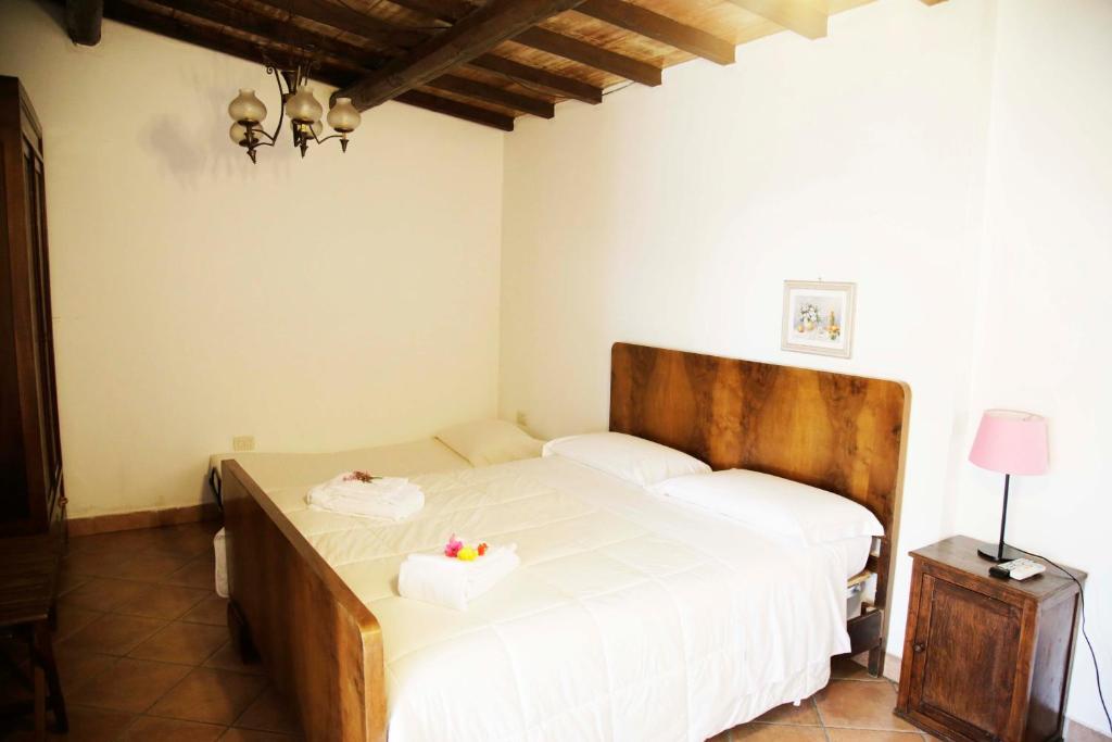 Postel nebo postele na pokoji v ubytování Agriturismo la Gioia