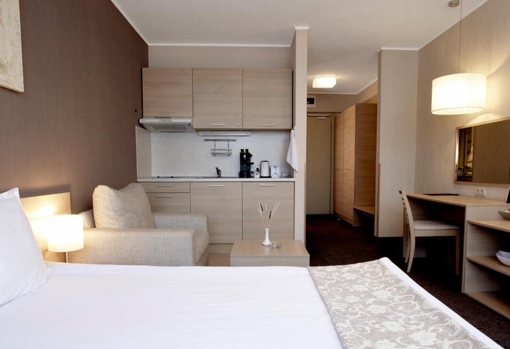 Postel nebo postele na pokoji v ubytování Lucky Bansko Aparthotel SPA & Relax