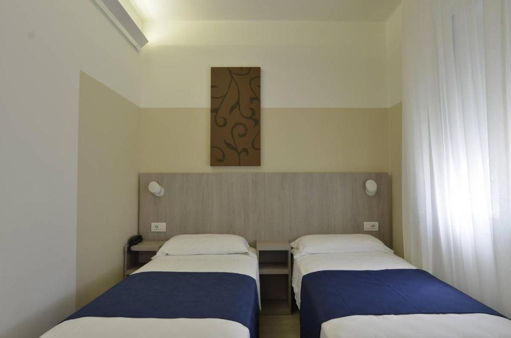 Postel nebo postele na pokoji v ubytování Hotel Mare Live