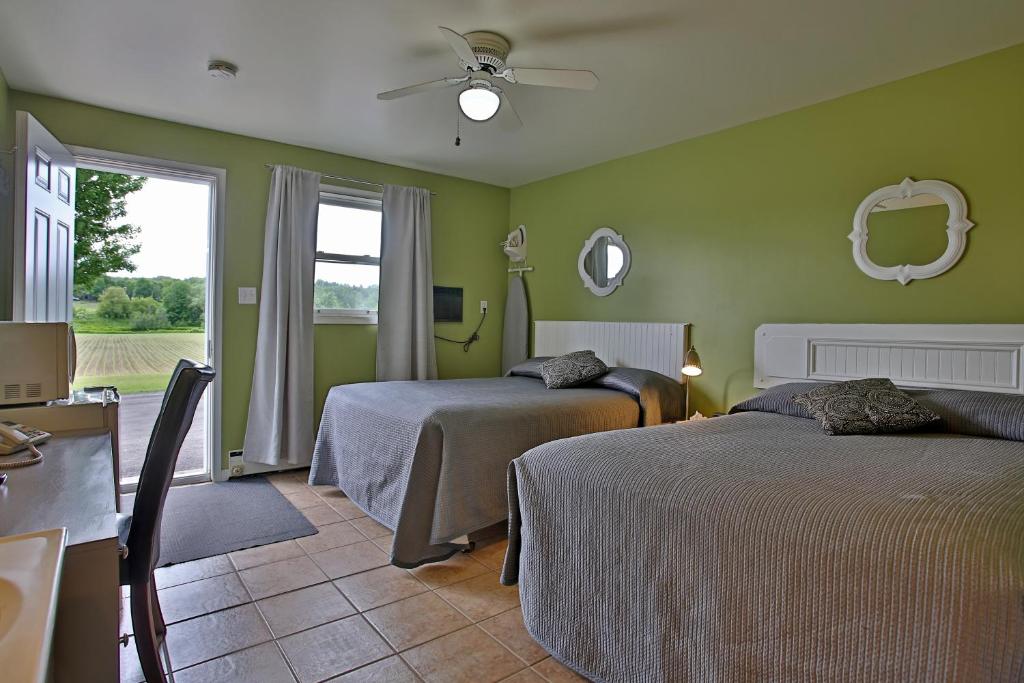 Postel nebo postele na pokoji v ubytování Motel Exquise