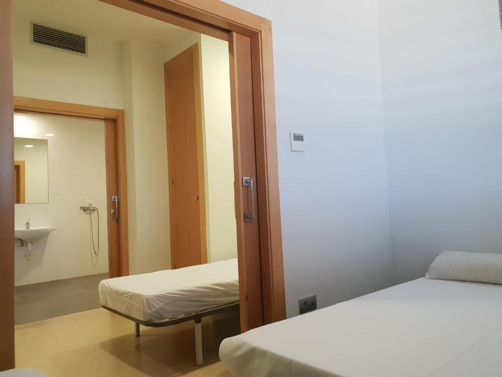 Postel nebo postele na pokoji v ubytování TuAlbergueJT