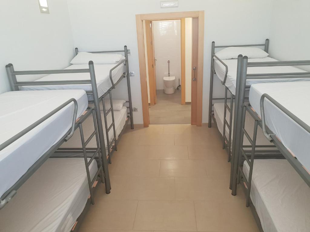 Postel nebo postele na pokoji v ubytování TuAlbergueJT