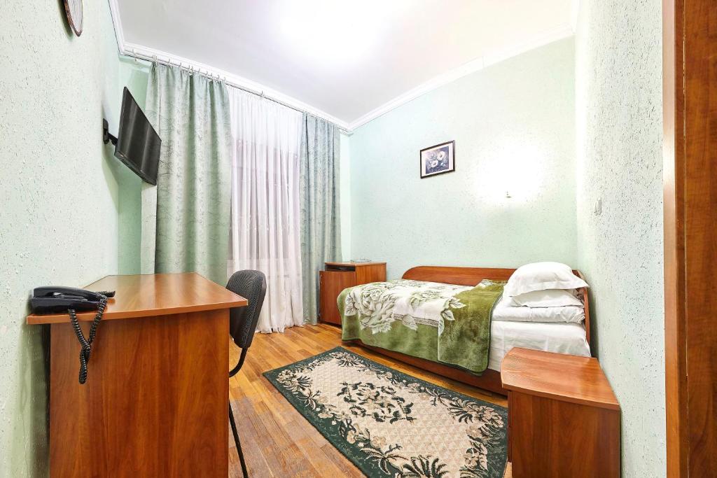 Postel nebo postele na pokoji v ubytování Resort Hotel Karpaty