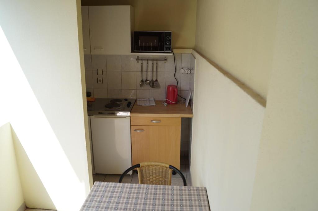 Kuchyň nebo kuchyňský kout v ubytování Studio Apartments Marija with private parking