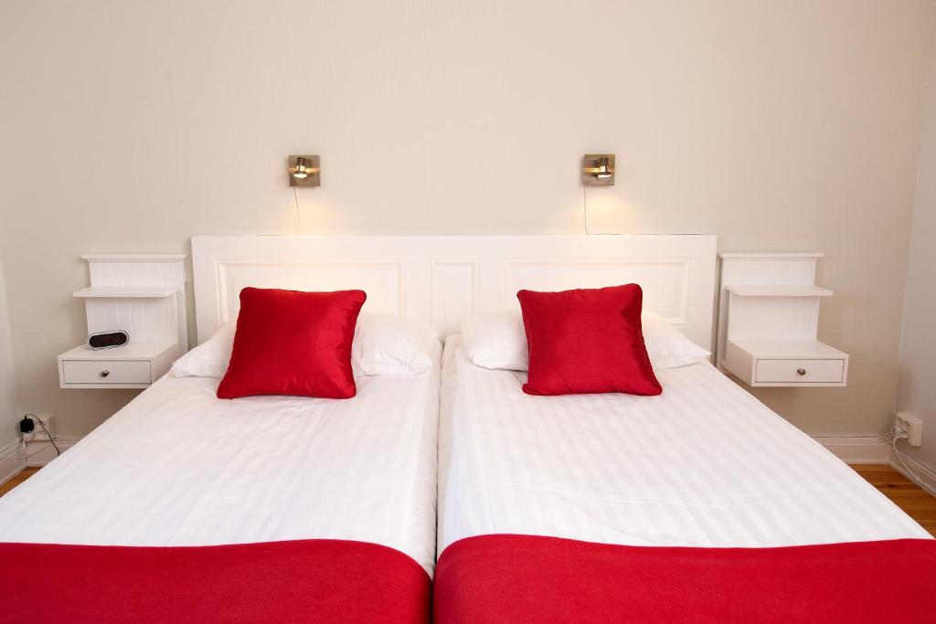 Postel nebo postele na pokoji v ubytování Hotel Emma