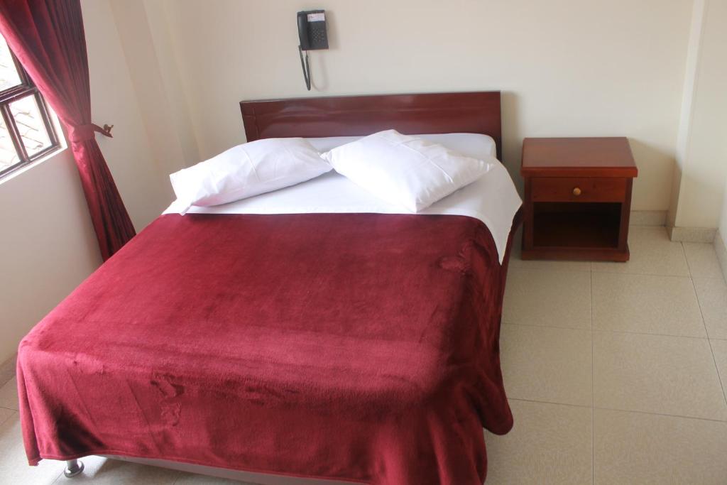 Postel nebo postele na pokoji v ubytování Hotel Vigua