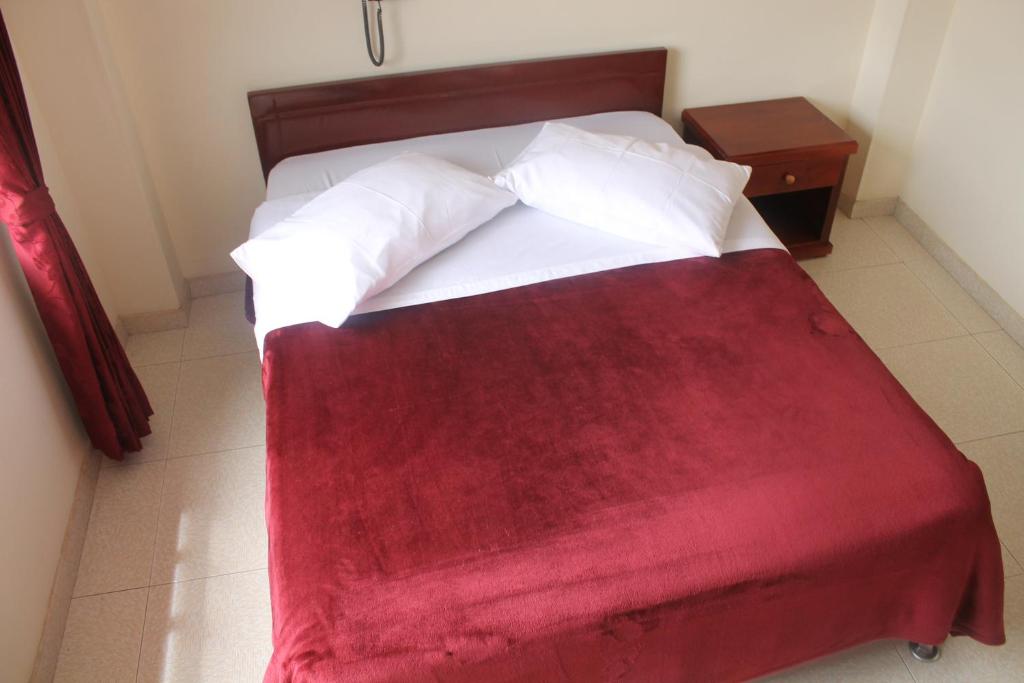 Postel nebo postele na pokoji v ubytování Hotel Vigua