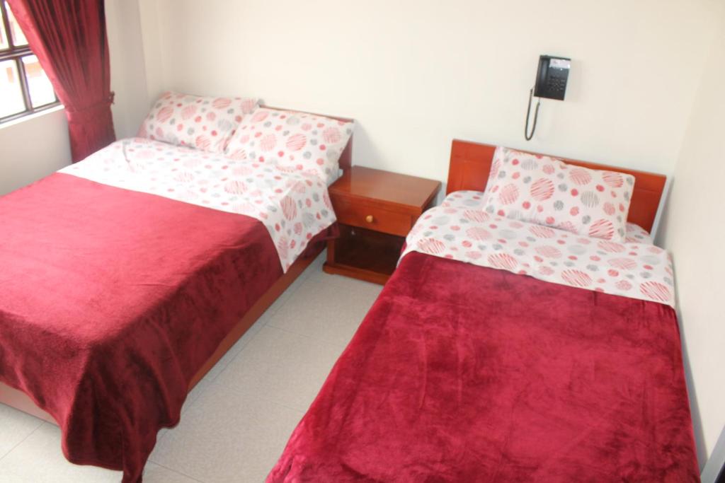 Postel nebo postele na pokoji v ubytování Hotel Vigua