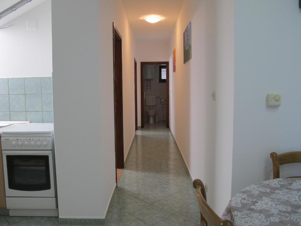Kuchyň nebo kuchyňský kout v ubytování Apartmani Stille