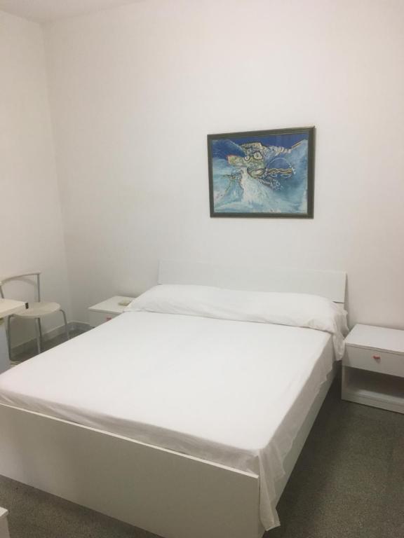 Postel nebo postele na pokoji v ubytování Hotel Morini