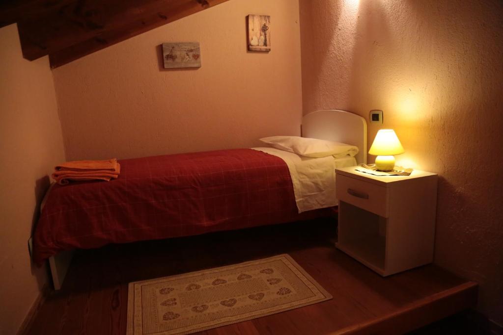 Posteľ alebo postele v izbe v ubytovaní B&B Vecchio Torchio di Bard
