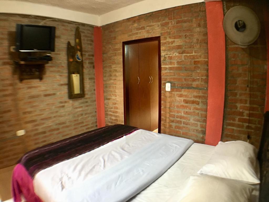 Llit o llits en una habitació de Cabañas La Carolina - Mesa de Los Santos