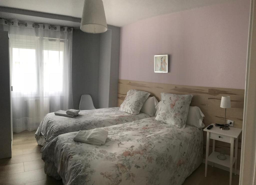 Postel nebo postele na pokoji v ubytování Alojamientos Olga