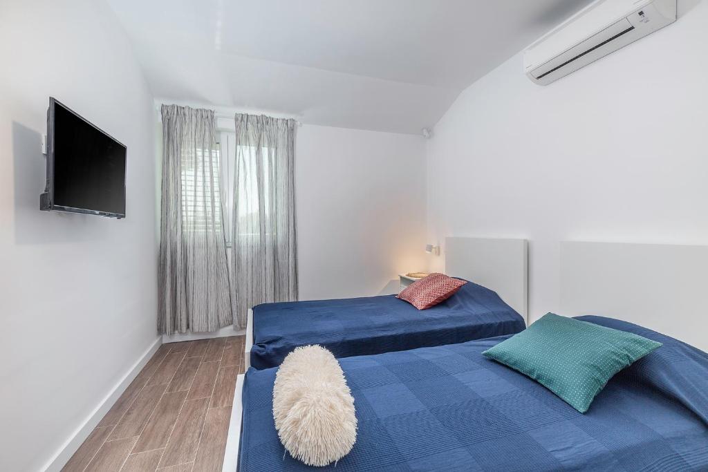 Posteľ alebo postele v izbe v ubytovaní Villa Polion Valbandon