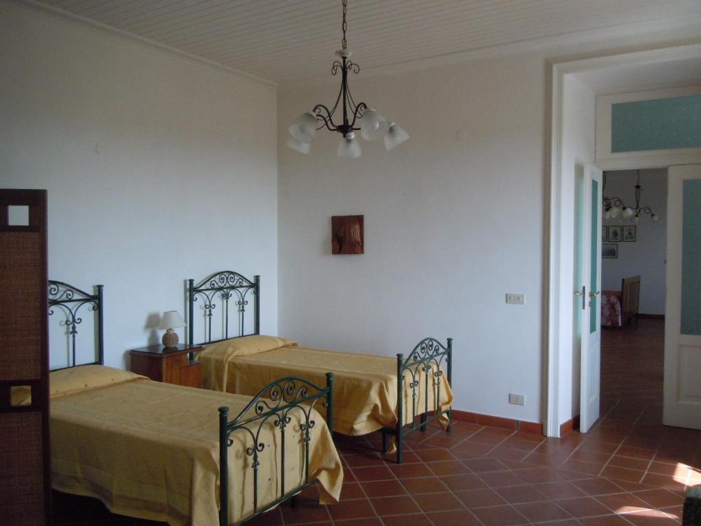 Postel nebo postele na pokoji v ubytování Agriturismo Le Carolee