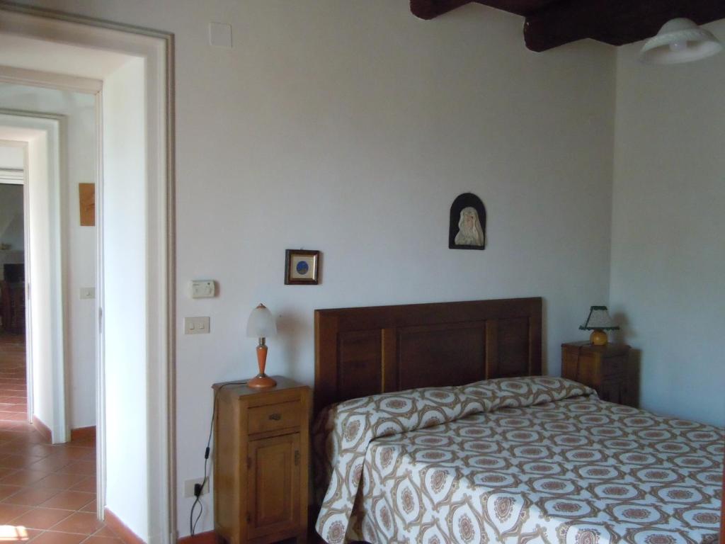 Postel nebo postele na pokoji v ubytování Agriturismo Le Carolee