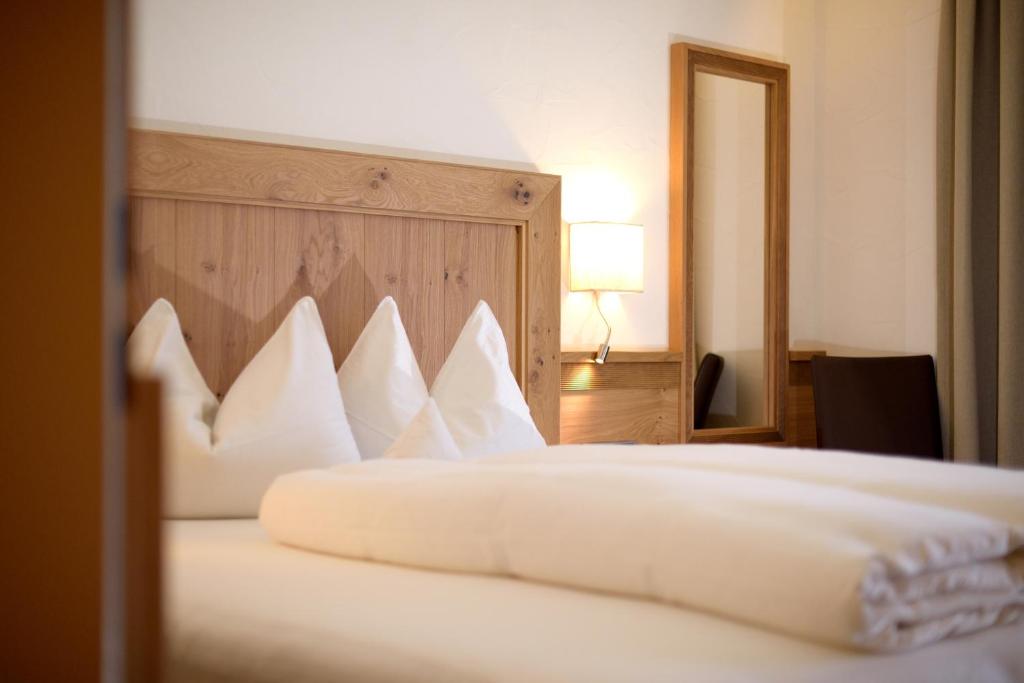 Postel nebo postele na pokoji v ubytování Aparthotel Garni Monte