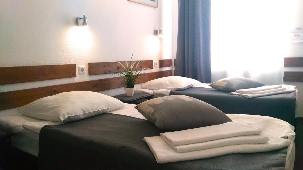 
Кровать или кровати в номере Отель PEOPLE Бизнес Новинский
