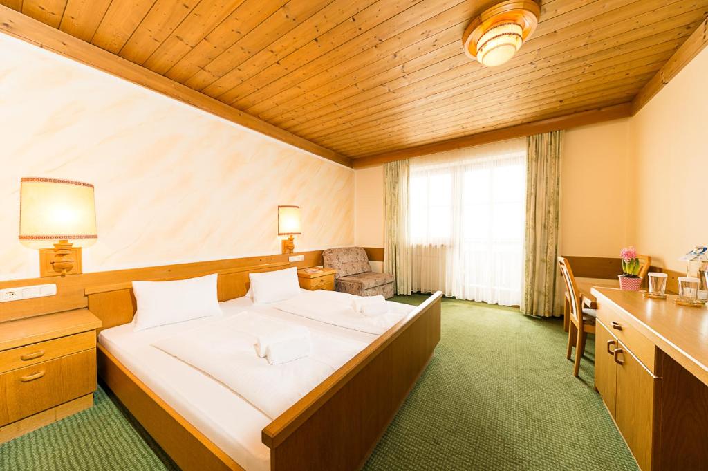 Postel nebo postele na pokoji v ubytování Almerwirt