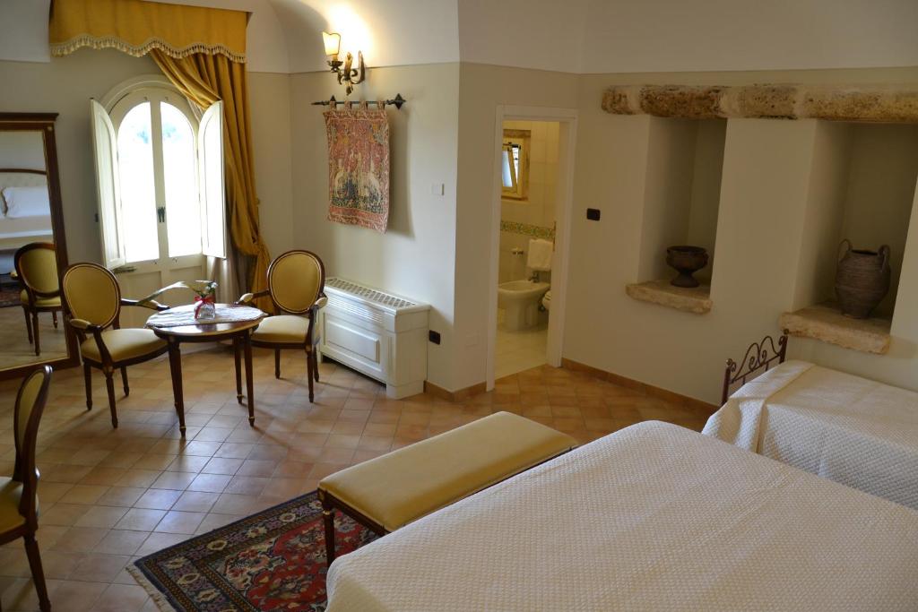 Postel nebo postele na pokoji v ubytování Sangiorgio Resort & Spa