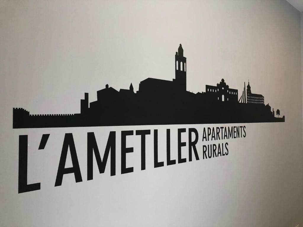 a silhouette of a city with the words jamelelvelt parties at Apartaments L`Ametller in Cervera