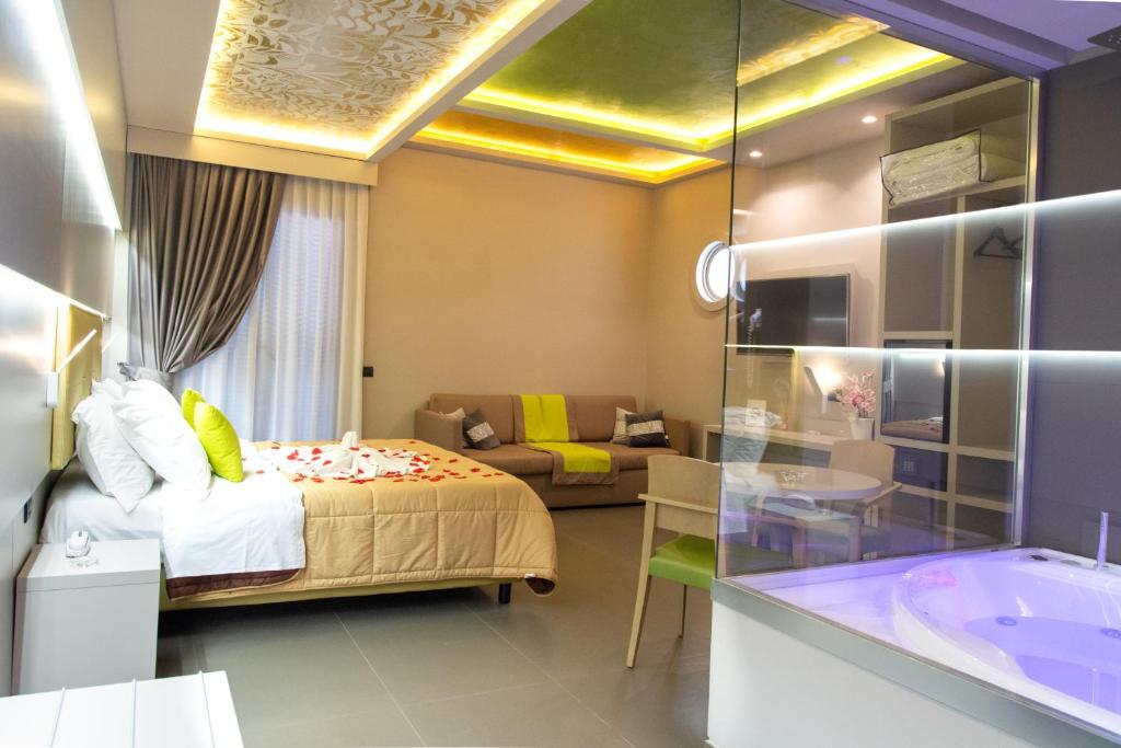 Postel nebo postele na pokoji v ubytování Hotel Miramare