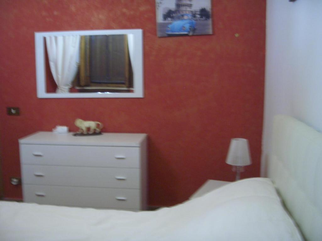A bed or beds in a room at L'Oasi di Ambra Dependance