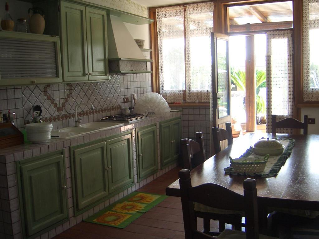 A kitchen or kitchenette at L'Oasi di Ambra Dependance