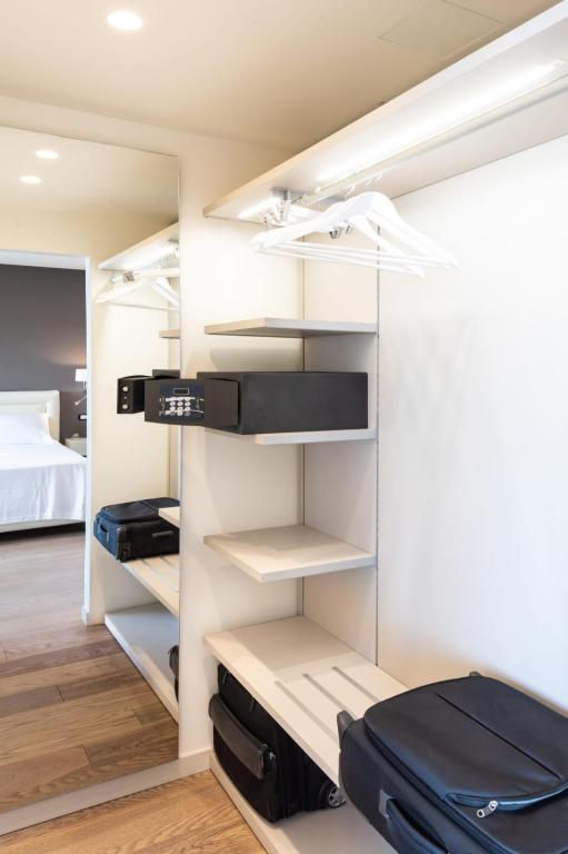 A bed or beds in a room at The View Luxury Apartments Taormina