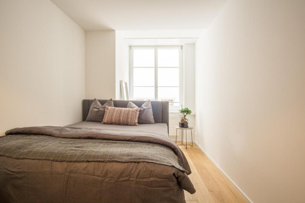 Postel nebo postele na pokoji v ubytování KoBi Apartments Hirschenplatz