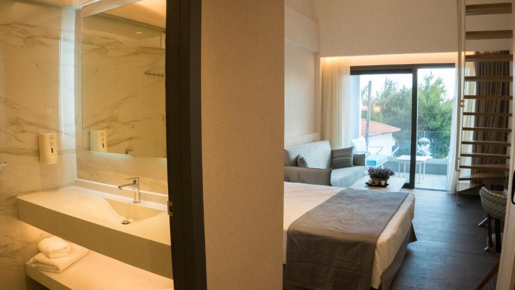 Posteľ alebo postele v izbe v ubytovaní Costa Domus Blue Luxury Apartments