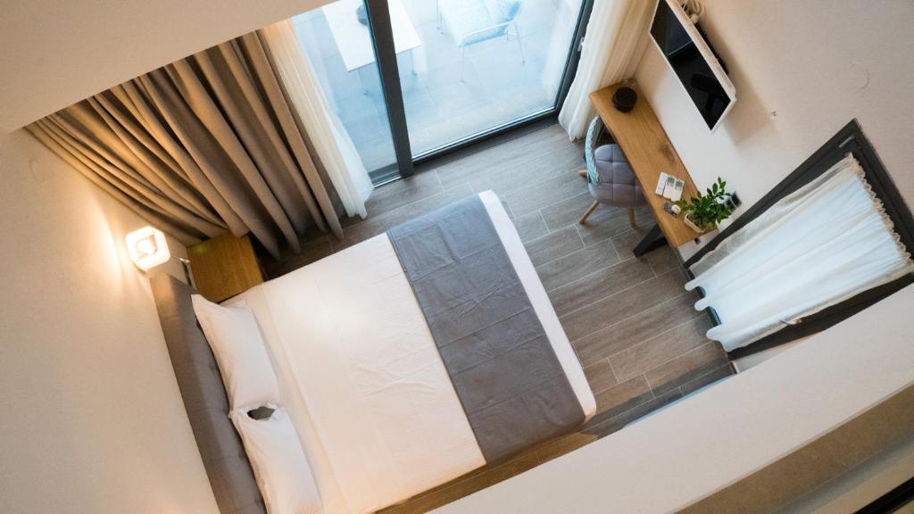 Televízia a/alebo spoločenská miestnosť v ubytovaní Costa Domus Blue Luxury Apartments