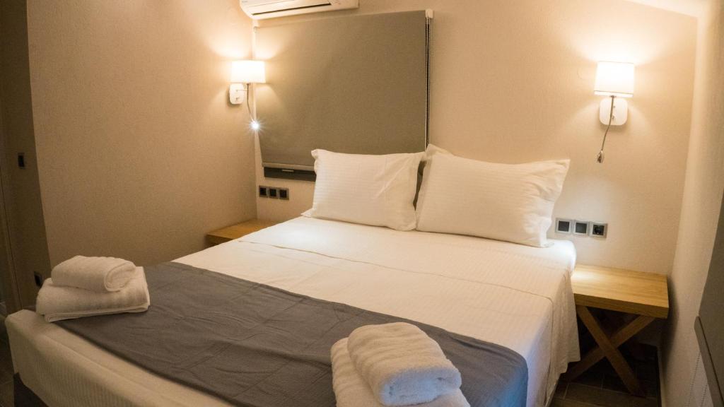 Posteľ alebo postele v izbe v ubytovaní Costa Domus Blue Luxury Apartments