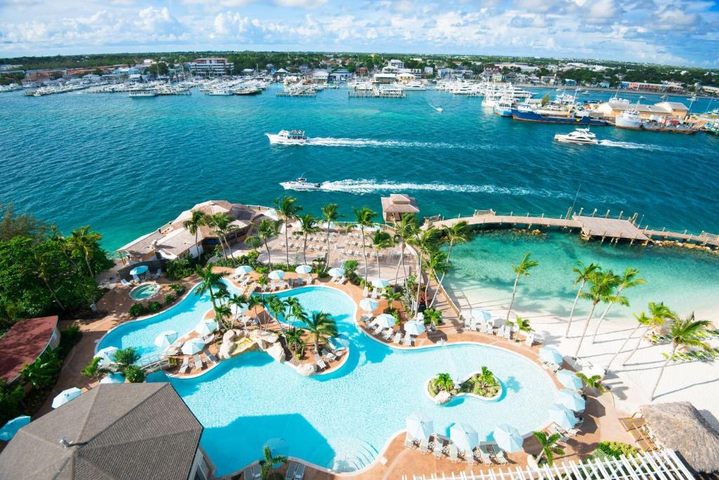 an aerial view of a resort with a marina at Warwick Paradise Island Bahamas - All Inclusive - Adults Only in Nassau