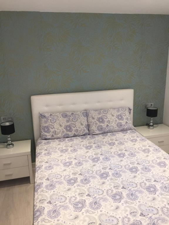 Postel nebo postele na pokoji v ubytování Casa Centro Benidorm