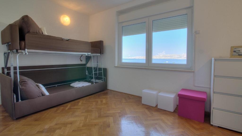 Posteľ alebo postele v izbe v ubytovaní Senj Apartment