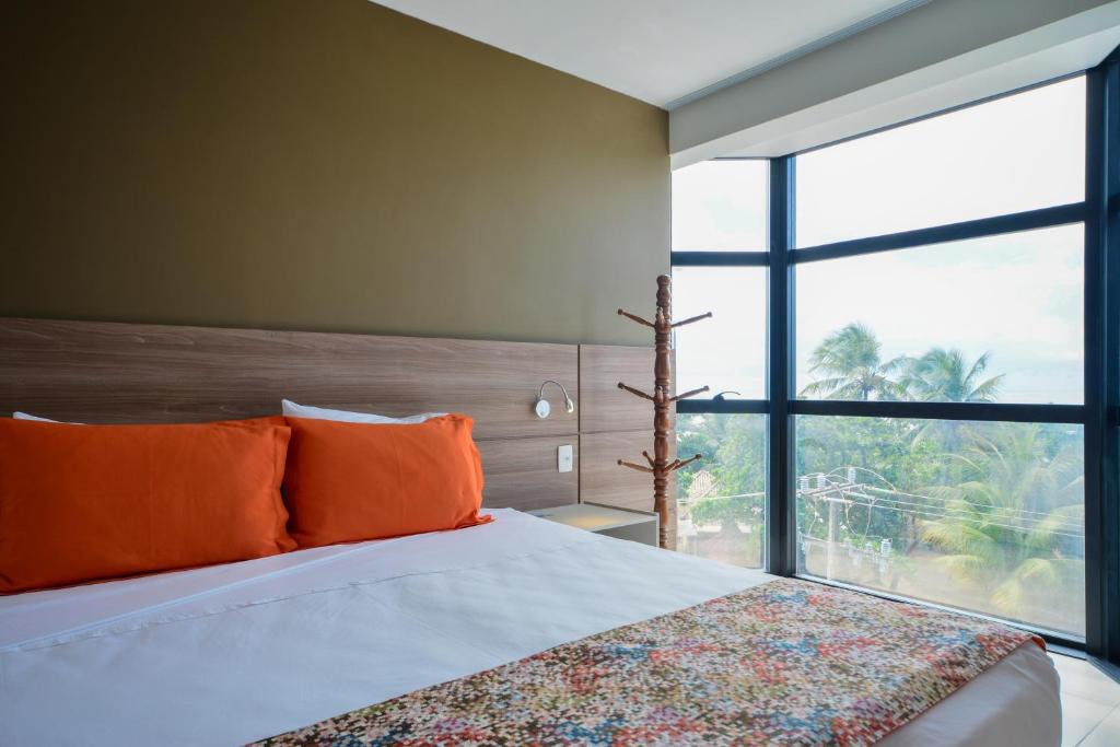Cama ou camas em um quarto em Littoral Hotel