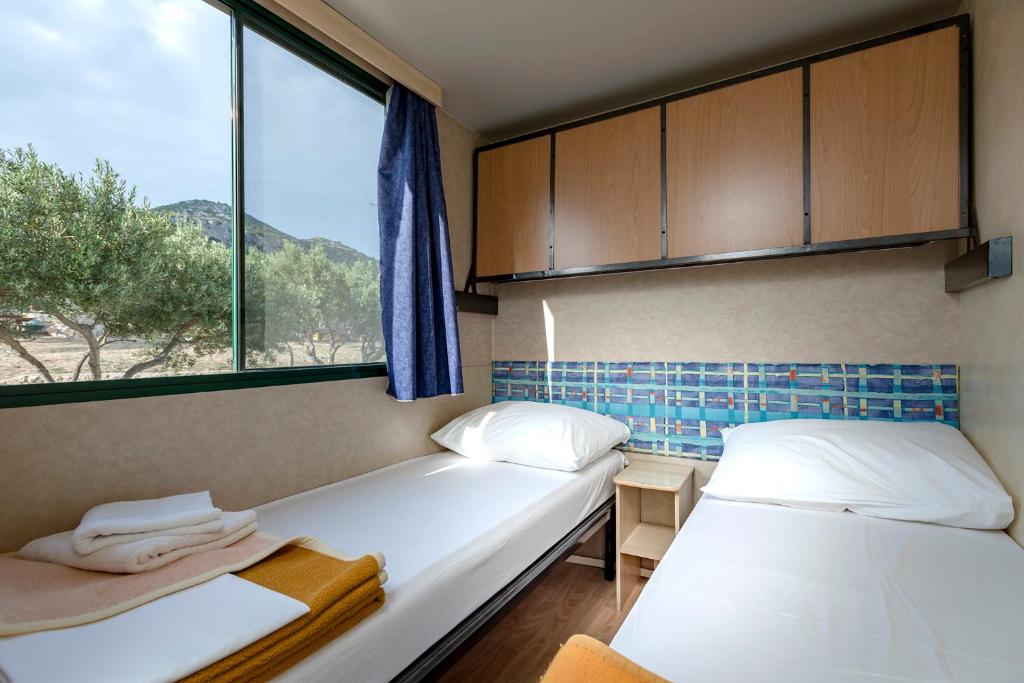 Postel nebo postele na pokoji v ubytování Camp Kopito