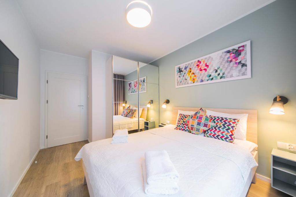 Posteľ alebo postele v izbe v ubytovaní GRANO APARTMENTS Gdańsk Motława SPA & Wellness