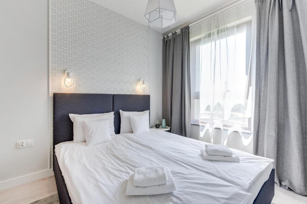 Posteľ alebo postele v izbe v ubytovaní GRANO APARTMENTS Gdańsk Motława SPA & Wellness