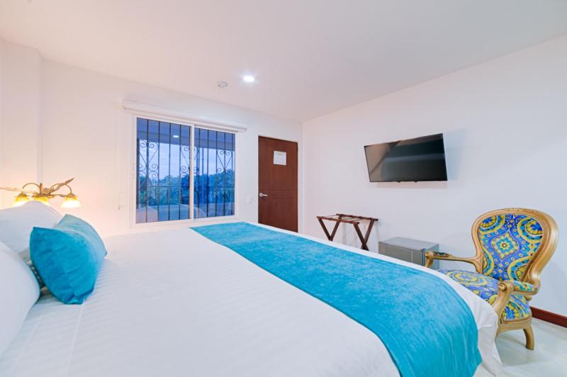 Katil atau katil-katil dalam bilik di Hotel Campestre Nala
