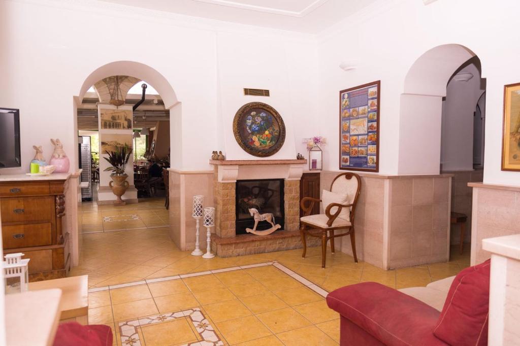 TV a/nebo společenská místnost v ubytování Hotel Villa A Mare
