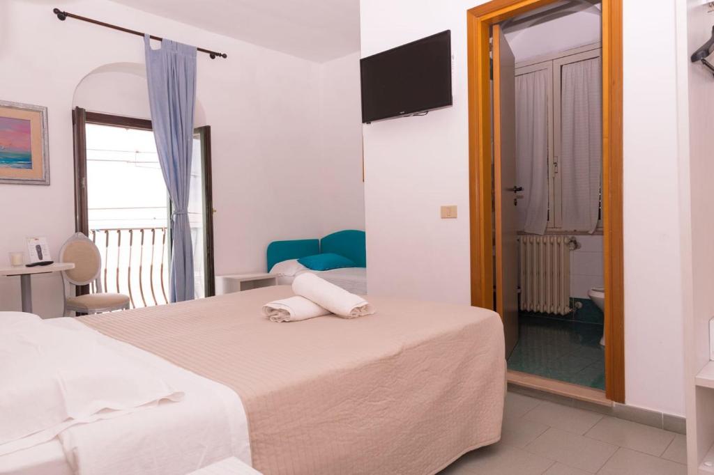 Postel nebo postele na pokoji v ubytování Hotel Villa A Mare