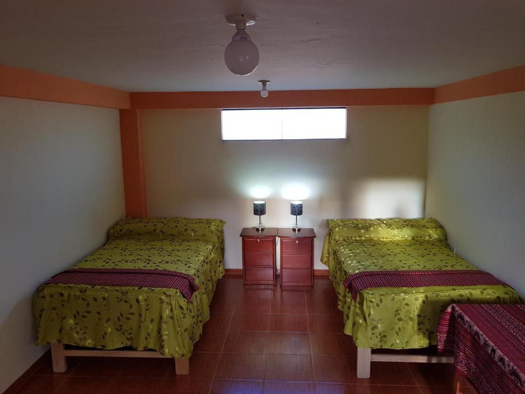 Postel nebo postele na pokoji v ubytování Feliz Vista Casa-Hospedaje