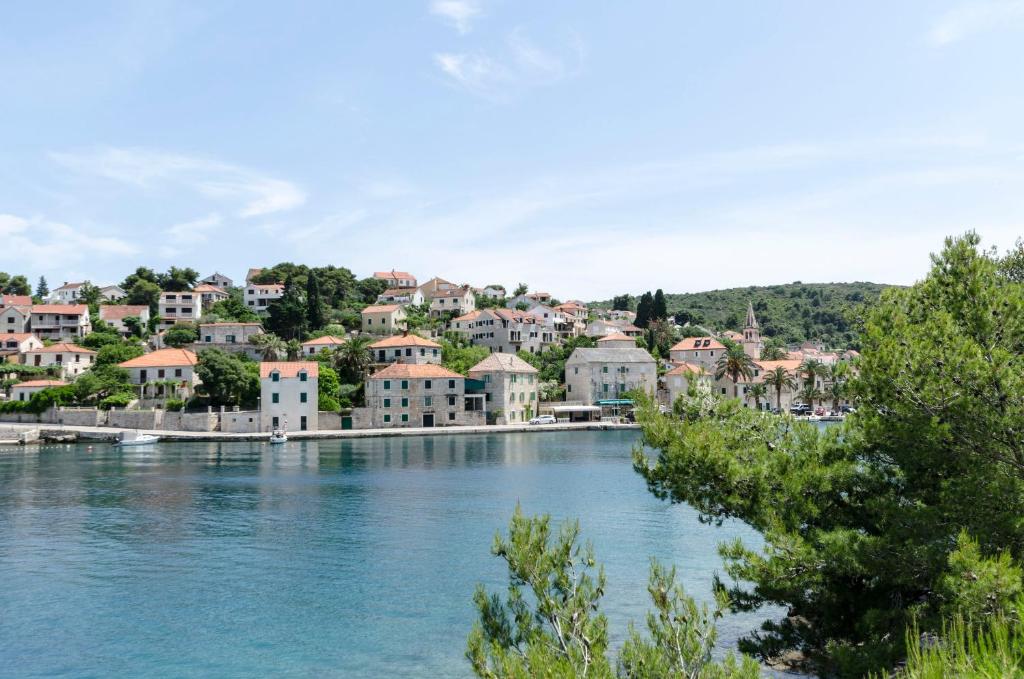 a small town on the shore of a river at Apartments Marinko in Splitska