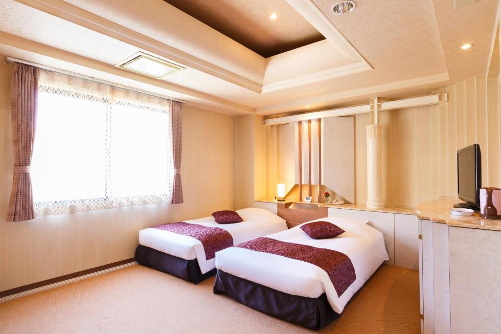 Postel nebo postele na pokoji v ubytování Hotel In Kyoto Sasarindou