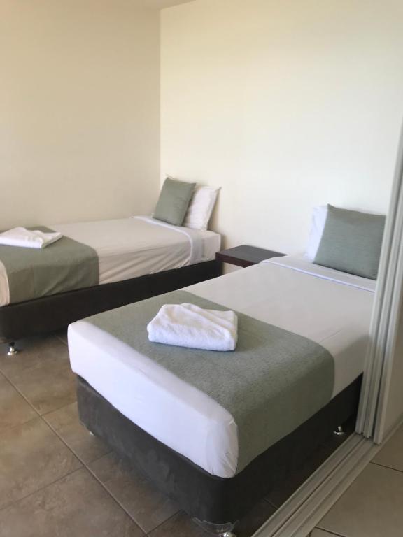 Postel nebo postele na pokoji v ubytování Gemini Resort