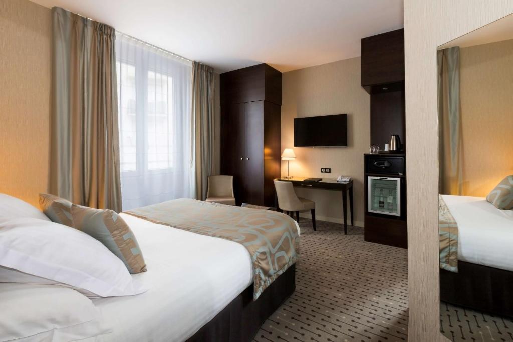 Postel nebo postele na pokoji v ubytování Best Western Plus Richelieu