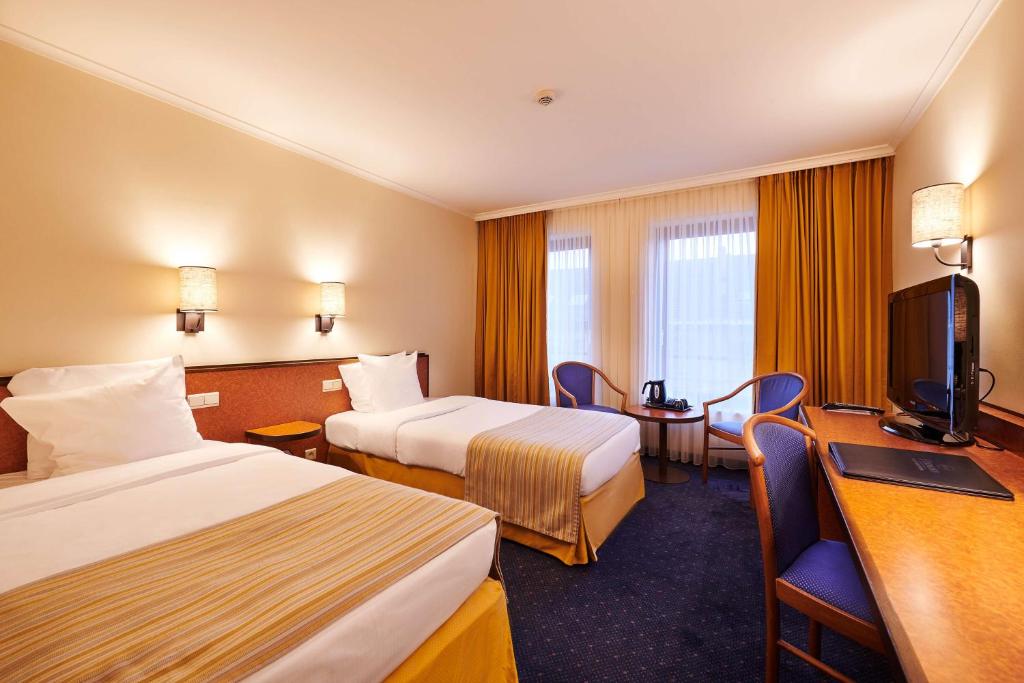 TV a/nebo společenská místnost v ubytování Keizershof Hotel Aalst
