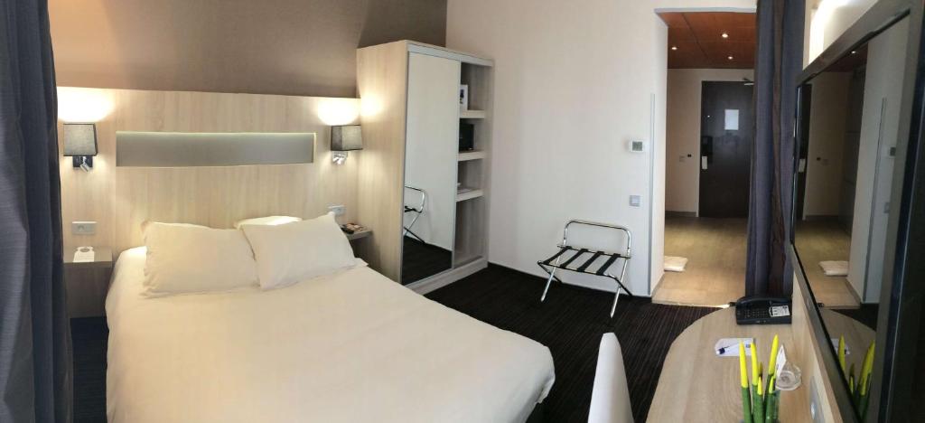 Postel nebo postele na pokoji v ubytování Best Western Marseille Aeroport